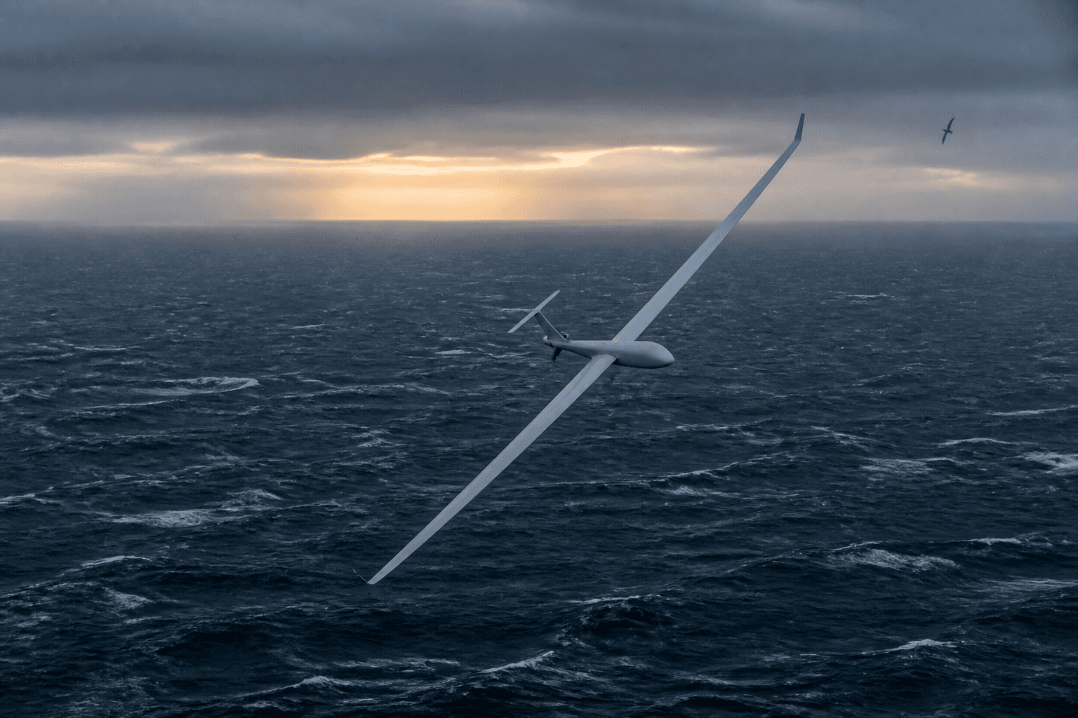 A long-wing autonomous research aircraft banking above a windswept ocean at dawn