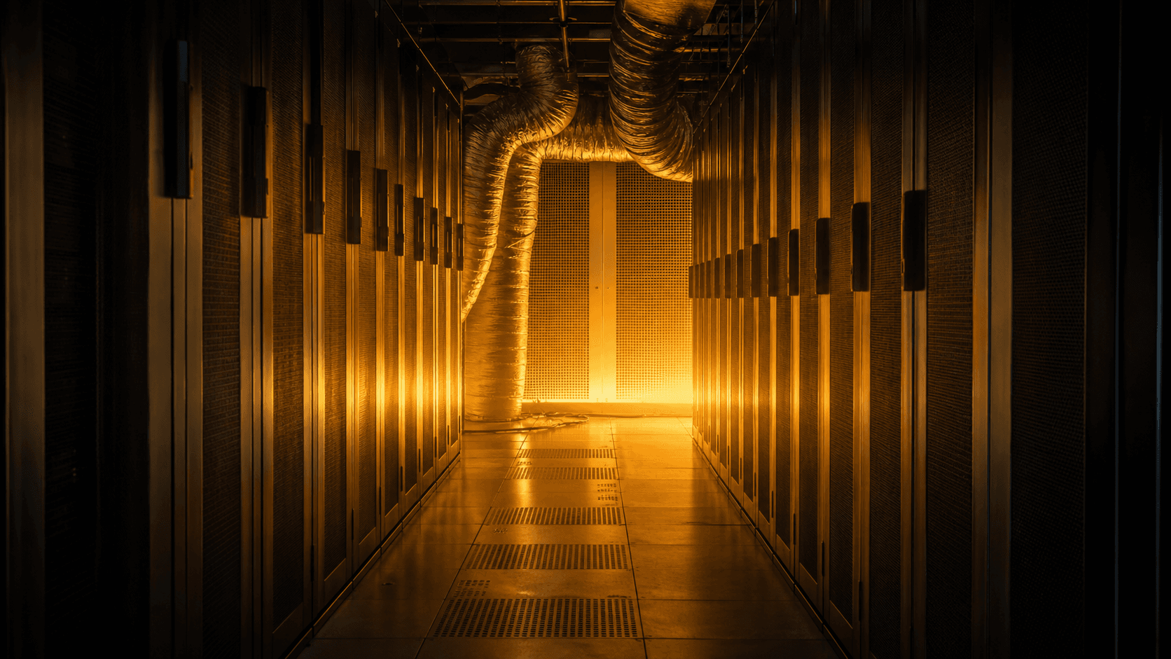 An overheated data center aisle illuminated by rising orange light